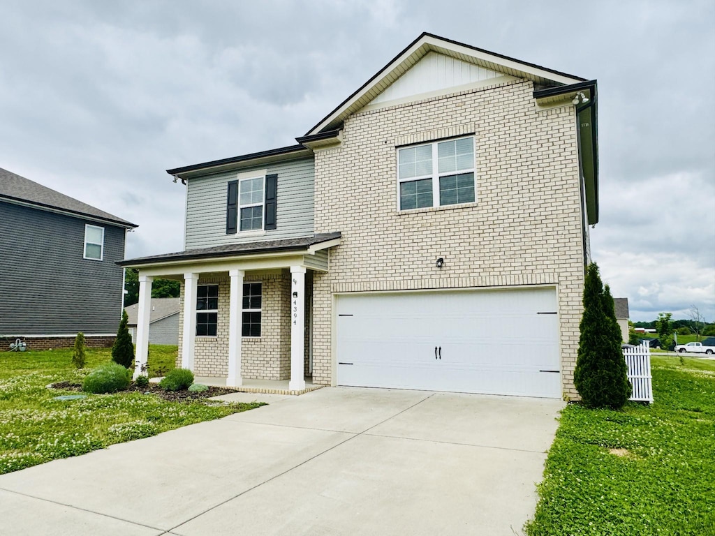 4394 Socata Ct, Cross Plains, TN 37049 - traditional-style house with brick siding, an attached garage, driveway, and a front lawn