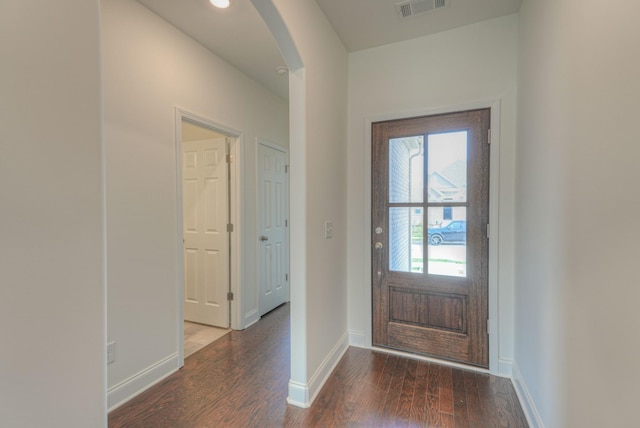 1765 Triple Crown Cir, Gallatin, TN 37066 - doorway to outside with arched walkways, wood finished floors, and baseboards