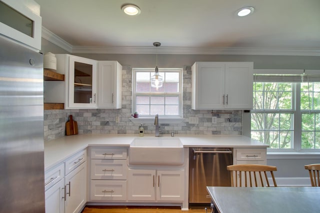 1334 Davy Crockett Dr, Murfreesboro, TN 37129 - kitchen with appliances with stainless steel finishes, a sink, white cabinets, light countertops, and decorative backsplash