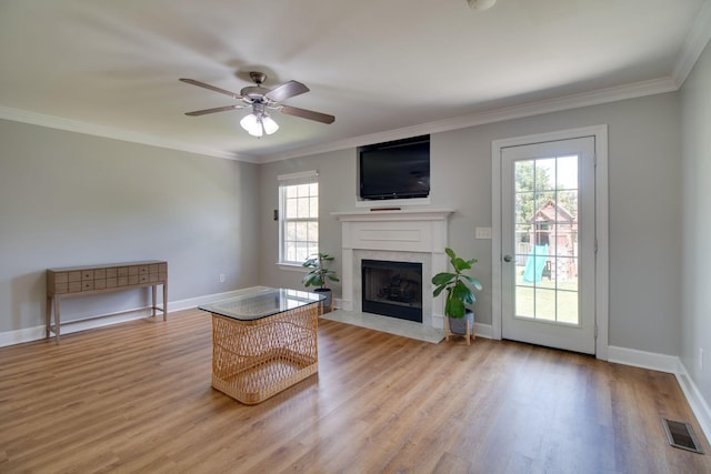 1334 Davy Crockett Dr, Murfreesboro, TN 37129 - living area featuring light wood-style flooring, a ceiling fan, a fireplace with flush hearth, ornamental molding, and baseboards