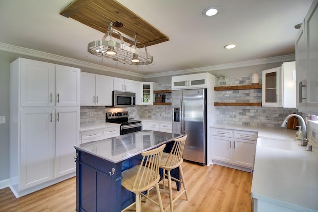 1334 Davy Crockett Dr, Murfreesboro, TN 37129 - kitchen with appliances with stainless steel finishes, open shelves, crown molding, white cabinetry, and a sink