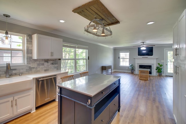 1334 Davy Crockett Dr, Murfreesboro, TN 37129 - kitchen featuring dishwasher, a sink, white cabinets, a ceiling fan, and a fireplace