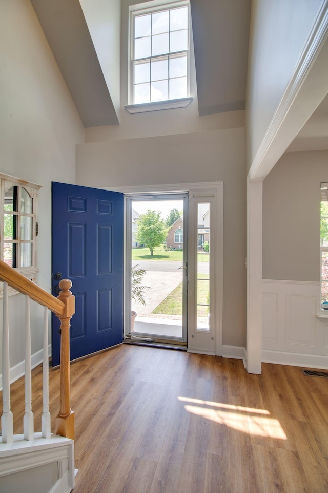 1334 Davy Crockett Dr, Murfreesboro, TN 37129 - foyer entrance featuring high vaulted ceiling, wood finished floors, and stairway