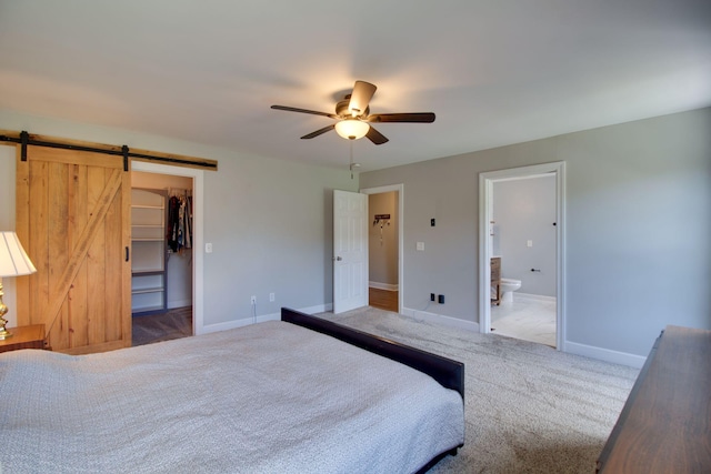 1334 Davy Crockett Dr, Murfreesboro, TN 37129 - carpeted bedroom with a spacious closet, a barn door, baseboards, a closet, and ensuite bath