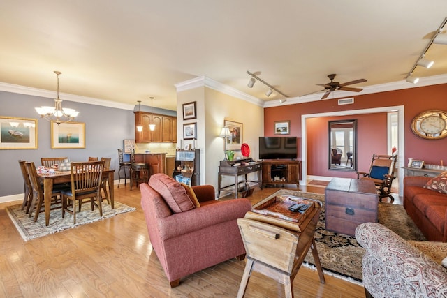 7100 Dale Ridge Rd Unit A4, Lancaster, TN 38569 - living area featuring rail lighting, a chandelier, light wood-style flooring, ceiling fan, and ornamental molding