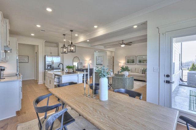 460 Triple Crown Cir, Gallatin, TN 37066 - dining room with recessed lighting, light wood-type flooring, beamed ceiling, ceiling fan, and crown molding