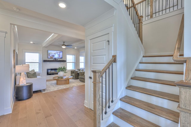 460 Triple Crown Cir, Gallatin, TN 37066 - stairs featuring a glass covered fireplace, ceiling fan, wood finished floors, beamed ceiling, and baseboards