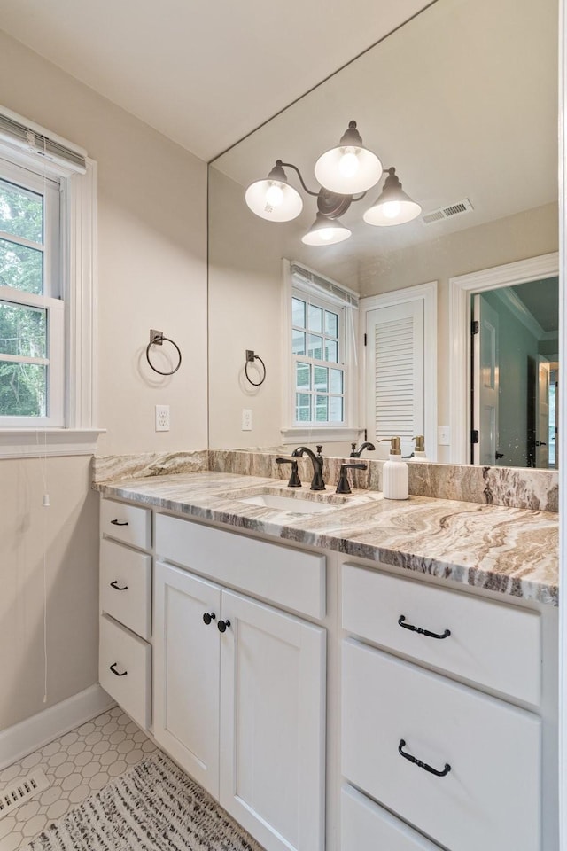 5175 Granny White Pike, Nashville, TN 37220 - bathroom featuring healthy amount of natural light, vanity, baseboards, and tile patterned flooring
