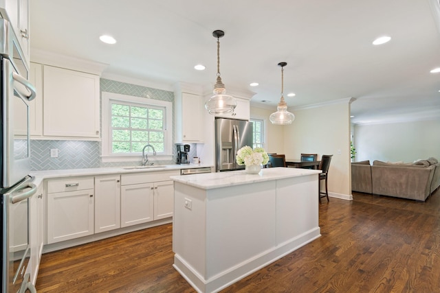 5175 Granny White Pike, Nashville, TN 37220 - kitchen featuring stainless steel refrigerator with ice dispenser, a sink, ornamental molding, a center island, and healthy amount of natural light