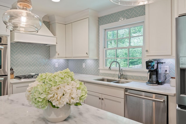 5175 Granny White Pike, Nashville, TN 37220 - kitchen featuring appliances with stainless steel finishes, a sink, white cabinets, and backsplash