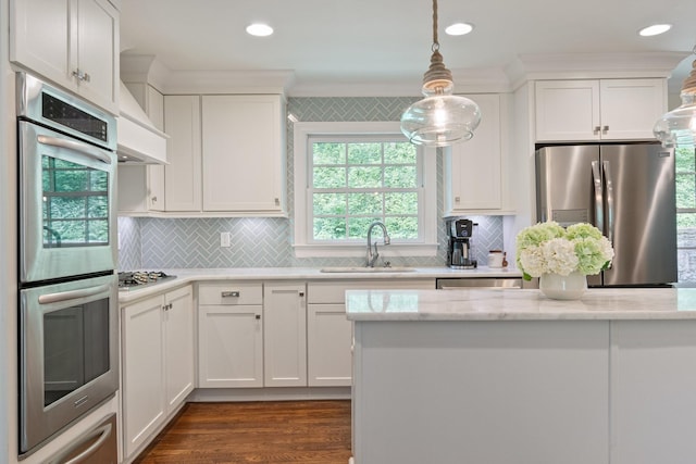 5175 Granny White Pike, Nashville, TN 37220 - kitchen with stainless steel appliances, a sink, crown molding, white cabinets, and healthy amount of natural light