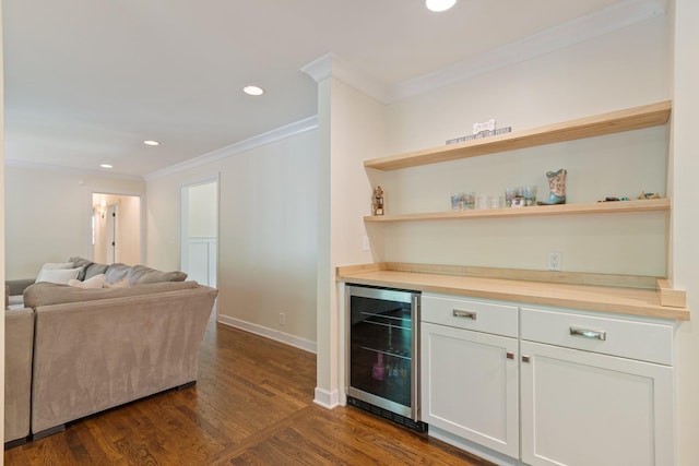 5175 Granny White Pike, Nashville, TN 37220 - indoor dry bar with beverage cooler, ornamental molding, dark wood-style floors, recessed lighting, and baseboards
