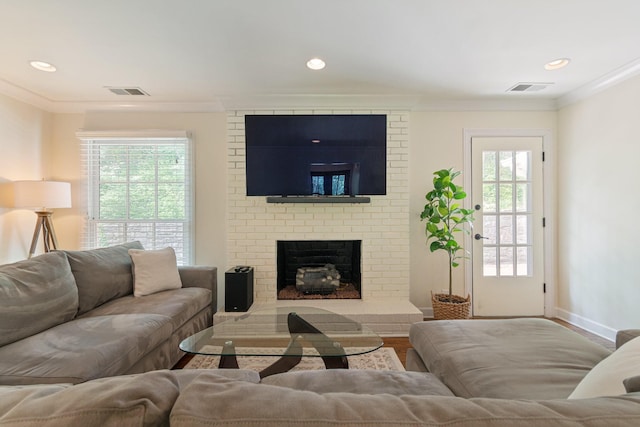5175 Granny White Pike, Nashville, TN 37220 - living area featuring a brick fireplace, wood finished floors, ornamental molding, plenty of natural light, and recessed lighting