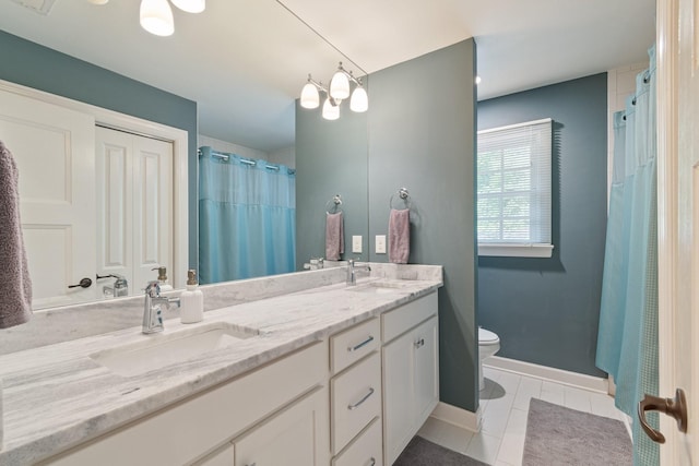5175 Granny White Pike, Nashville, TN 37220 - full bath featuring toilet, tile patterned floors, double vanity, baseboards, and a shower with shower curtain