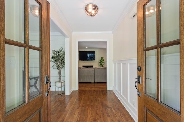 5175 Granny White Pike, Nashville, TN 37220 - doorway featuring ornamental molding, dark wood-style flooring, a wainscoted wall, and a decorative wall