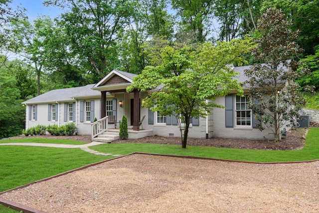 5175 Granny White Pike, Nashville, TN 37220 - view of front facade with a front lawn, brick siding, a porch, roof with shingles, and central air condition unit