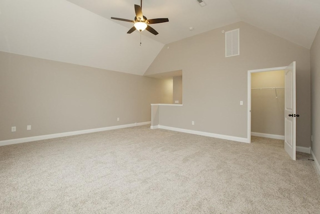 additional living space featuring vaulted ceiling, ceiling fan, light colored carpet, and baseboards