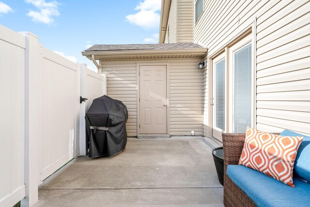 view of patio / terrace featuring a grill and fence