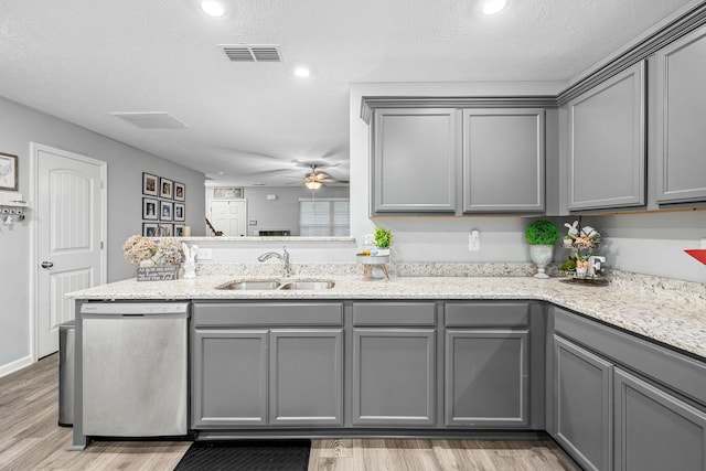 kitchen featuring dishwasher, gray cabinetry, a sink, a ceiling fan, and recessed lighting