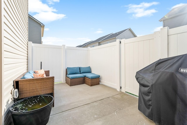 view of patio featuring a grill and a fenced backyard