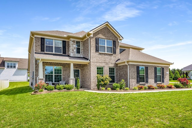 1149 Brixworth Dr, Spring Hill, TN 37174 - view of front facade with brick siding, a front lawn, and roof with shingles