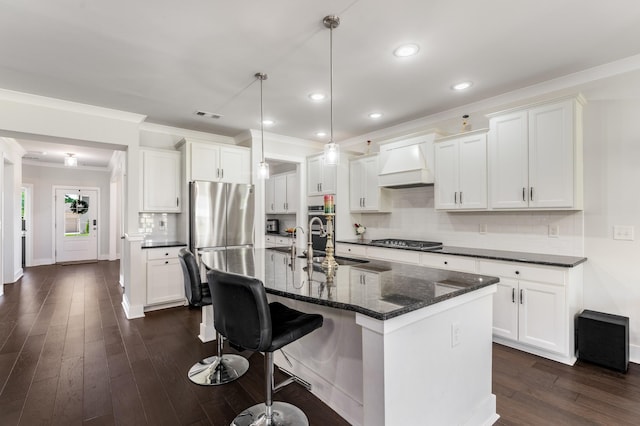 1149 Brixworth Dr, Spring Hill, TN 37174 - kitchen with a sink, custom range hood, appliances with stainless steel finishes, crown molding, and tasteful backsplash
