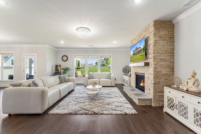 1149 Brixworth Dr, Spring Hill, TN 37174 - living room featuring ornamental molding, dark wood-style floors, and a stone fireplace