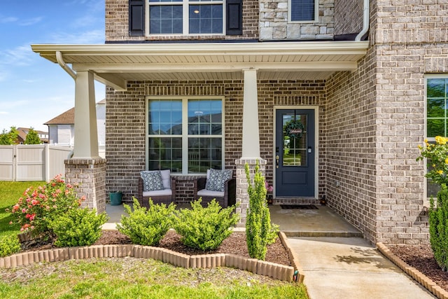 1149 Brixworth Dr, Spring Hill, TN 37174 - entrance to property featuring a porch, brick siding, and fence