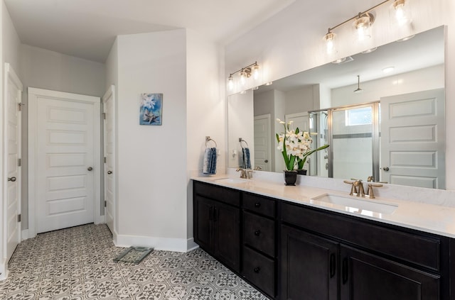 1149 Brixworth Dr, Spring Hill, TN 37174 - full bathroom with a stall shower, baseboards, and double vanity