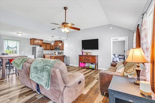 890 Akersville Rd, Lafayette, TN 37083 - living room featuring light wood-style flooring, lofted ceiling, a ceiling fan, and baseboards