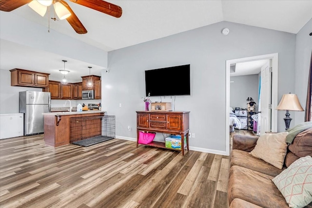 890 Akersville Rd, Lafayette, TN 37083 - living area with a ceiling fan, light wood-type flooring, vaulted ceiling, and baseboards