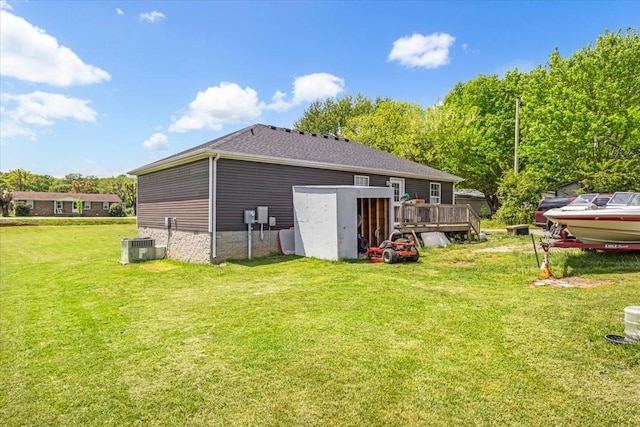 890 Akersville Rd, Lafayette, TN 37083 - rear view of house featuring a deck, a yard, and central air condition unit