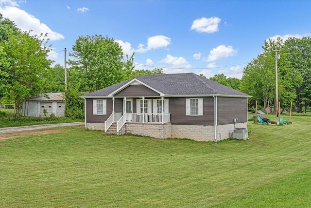 890 Akersville Rd, Lafayette, TN 37083 - view of front facade featuring a porch, a front yard, crawl space, central AC unit, and view of wooded area