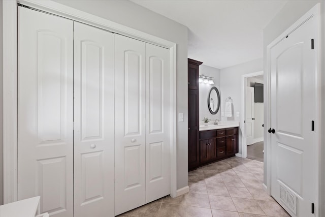 593 Gaulden Hollow Rd, Lafayette, TN 37083 - full bathroom featuring vanity, tile patterned floors, baseboards, and a closet