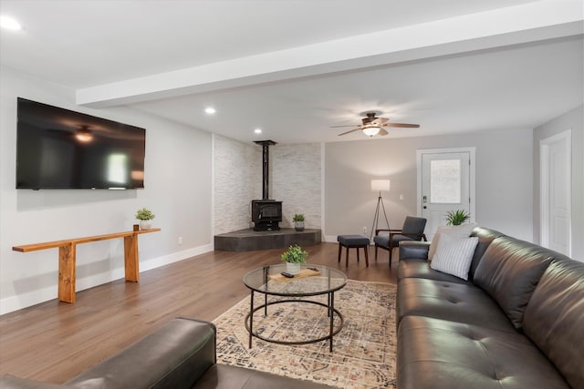 593 Gaulden Hollow Rd, Lafayette, TN 37083 - living area with a wood stove, baseboards, wood finished floors, a ceiling fan, and recessed lighting