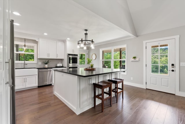 593 Gaulden Hollow Rd, Lafayette, TN 37083 - kitchen featuring appliances with stainless steel finishes, dark countertops, plenty of natural light, white cabinets, and recessed lighting