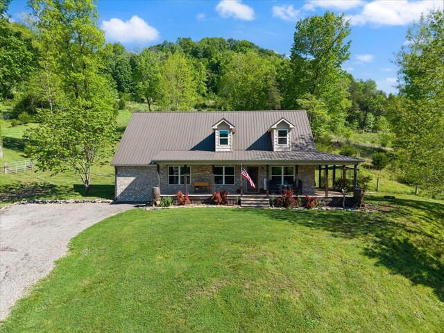 593 Gaulden Hollow Rd, Lafayette, TN 37083 - view of front of property featuring covered porch, gravel driveway, metal roof, and a forest view