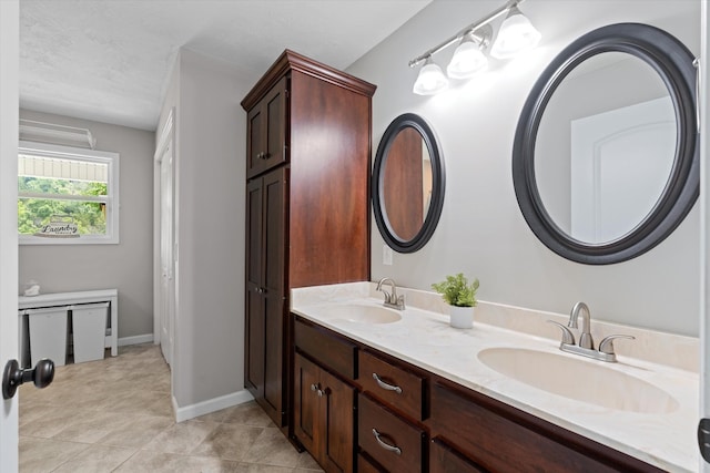 593 Gaulden Hollow Rd, Lafayette, TN 37083 - bathroom featuring double vanity, tile patterned floors, and baseboards