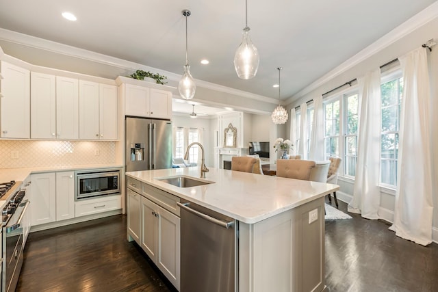 3692 Auburn Ln, Nashville, TN 37215 - kitchen featuring premium appliances, a sink, dark wood-style flooring, healthy amount of natural light, and crown molding