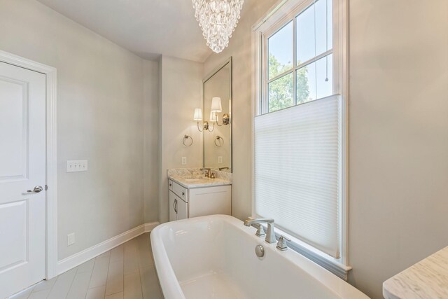 3692 Auburn Ln, Nashville, TN 37215 - bathroom featuring a soaking tub, a chandelier, baseboards, and vanity