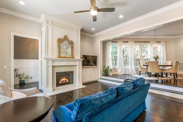 3692 Auburn Ln, Nashville, TN 37215 - living room featuring dark wood finished floors, a ceiling fan, a high end fireplace, ornamental molding, and recessed lighting