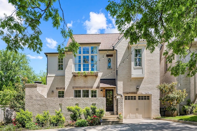 3692 Auburn Ln, Nashville, TN 37215 - view of front facade featuring a garage, driveway, and brick siding