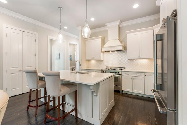 3692 Auburn Ln, Nashville, TN 37215 - kitchen with appliances with stainless steel finishes, premium range hood, a sink, light countertops, and dark wood-style flooring