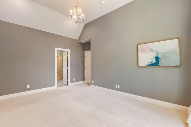 3692 Auburn Ln, Nashville, TN 37215 - unfurnished bedroom featuring a chandelier, carpet, baseboards, connected bathroom, and high vaulted ceiling