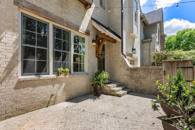 3692 Auburn Ln, Nashville, TN 37215 - view of property exterior featuring fence, brick siding, and a patio