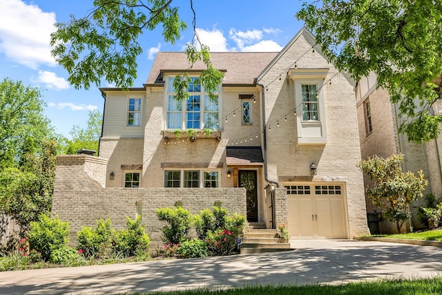 3692 Auburn Ln, Nashville, TN 37215 - view of front facade with driveway, a garage, fence, and stone siding