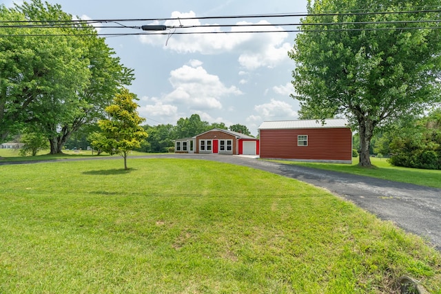 82 Drake And Shockley St, Spencer, TN 38585 - view of front of house with an outbuilding, a front yard, and driveway