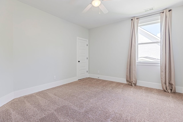 unfurnished room featuring ceiling fan, carpet floors, and baseboards