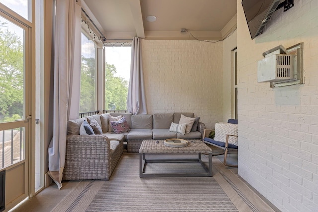sunroom / solarium with brick wall