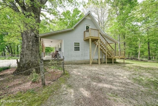 6756 Old State Highway 111, Spencer, TN 38585 - rear view of house featuring stairway, crawl space, a wooden deck, fence, and a balcony